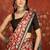 Red silk cotton printed saree with unstitched blouse piece.