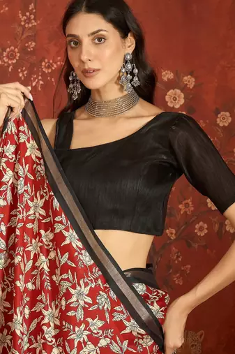 Red silk cotton printed saree with unstitched blouse piece.