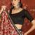 Red silk cotton printed saree with unstitched blouse piece.