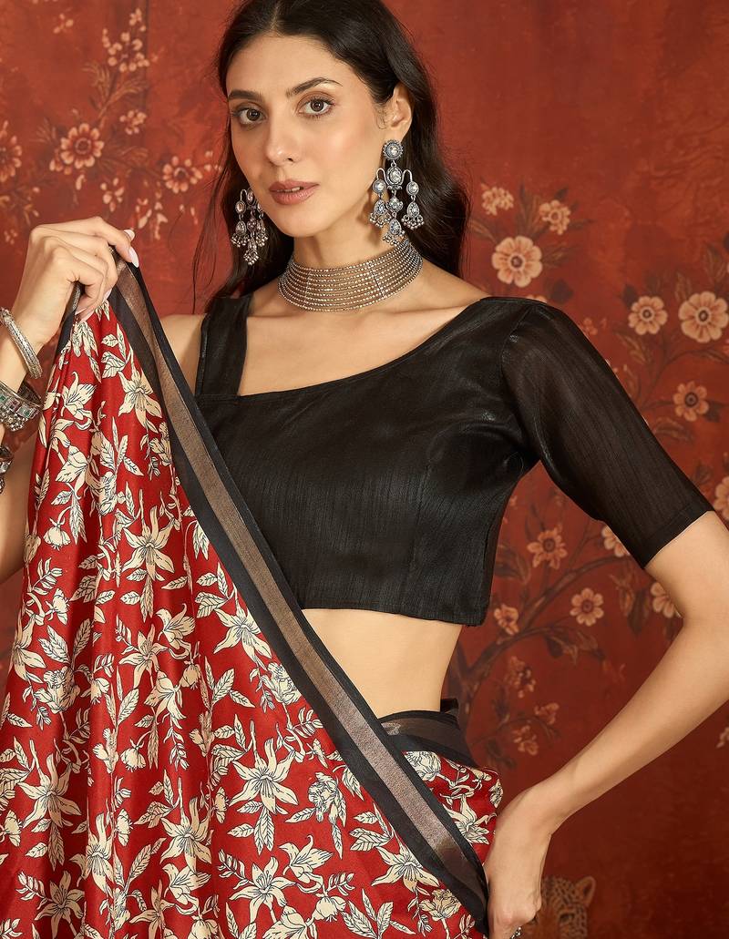Red silk cotton printed saree with unstitched blouse piece.
