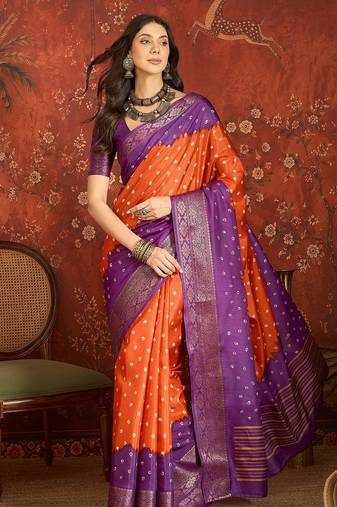 Orange silk cotton printed saree with unstitched blouse piece.