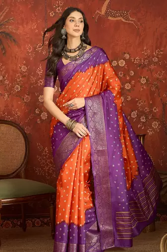 Orange silk cotton printed saree with unstitched blouse piece.