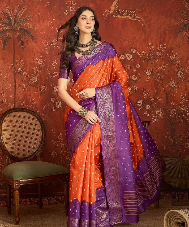 Orange silk cotton printed saree with unstitched blouse piece.