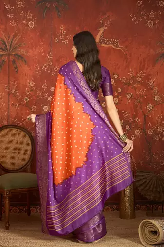Orange silk cotton printed saree with unstitched blouse piece.