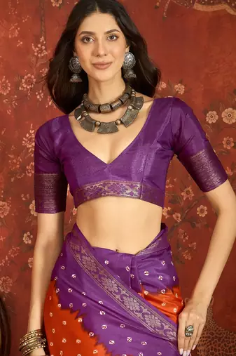 Orange silk cotton printed saree with unstitched blouse piece.