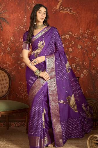 Purple silk cotton printed saree with unstitched blouse piece.