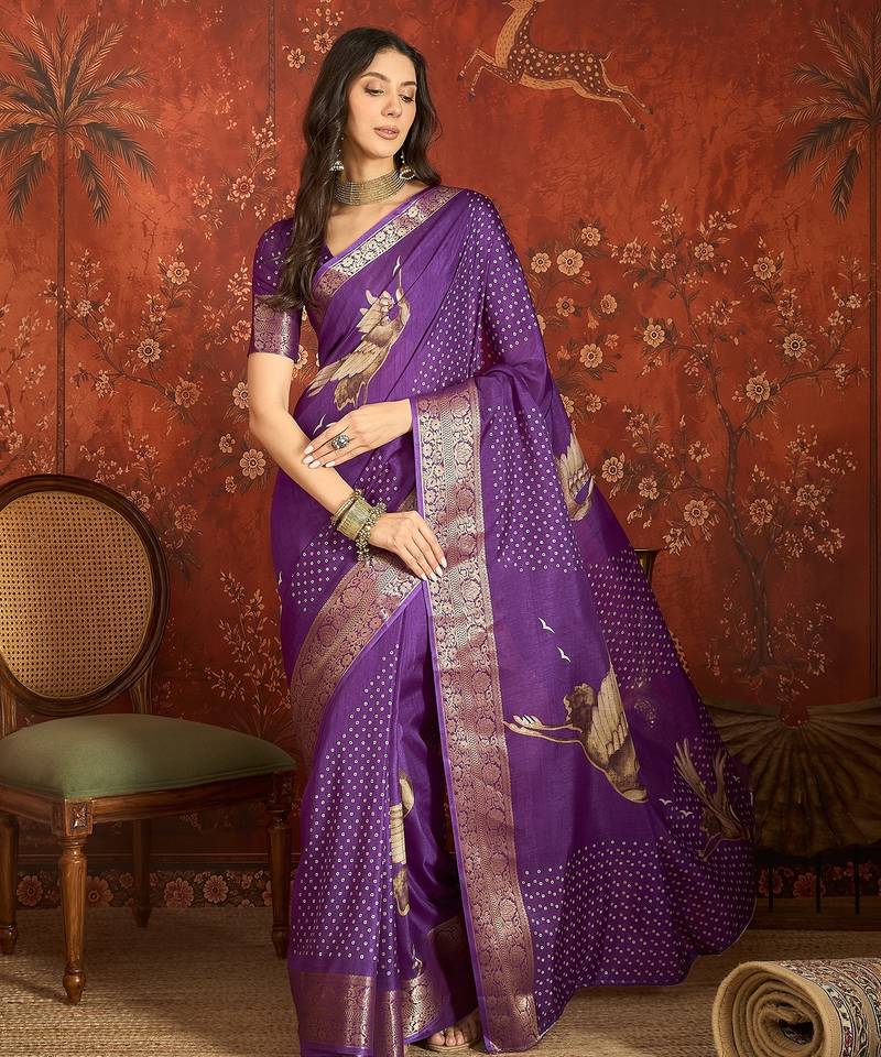 Purple silk cotton printed saree with unstitched blouse piece.