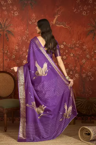 Purple silk cotton printed saree with unstitched blouse piece.
