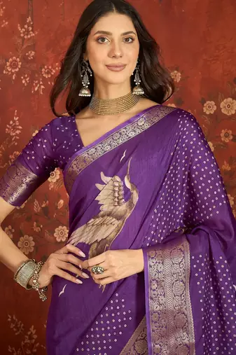 Purple silk cotton printed saree with unstitched blouse piece.