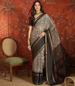 Grey silk cotton printed saree with unstitched blouse piece.