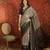 Grey silk cotton printed saree with unstitched blouse piece.