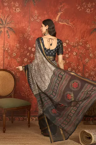 Grey silk cotton printed saree with unstitched blouse piece.