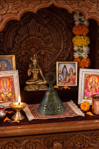 Big bronze hindu bell with puja room