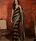 Black & gold tissue satin sequins saree with unstitched blouse piece.