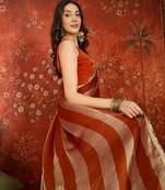 Orange & gold tissue satin sequins saree with unstitched blouse piece.