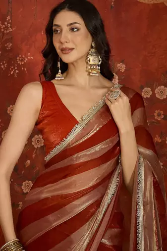 Orange & gold tissue satin sequins saree with unstitched blouse piece.
