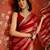 Rani & gold tissue satin sequins saree with unstitched blouse piece.