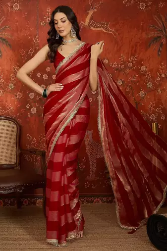 Rani & gold tissue satin sequins saree with unstitched blouse piece.