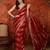 Rani & gold tissue satin sequins saree with unstitched blouse piece.
