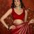 Rani & gold tissue satin sequins saree with unstitched blouse piece.