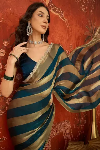 Teal & gold tissue satin sequins saree with unstitched blouse piece.