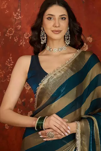 Teal & gold tissue satin sequins saree with unstitched blouse piece.