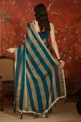 Teal & gold tissue satin sequins saree with unstitched blouse piece.