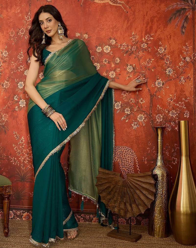 Rama & gold tissue satin sequins saree with unstitched blouse piece.
