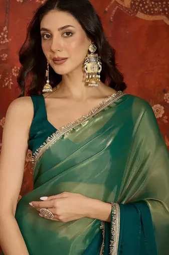 Rama & gold tissue satin sequins saree with unstitched blouse piece.