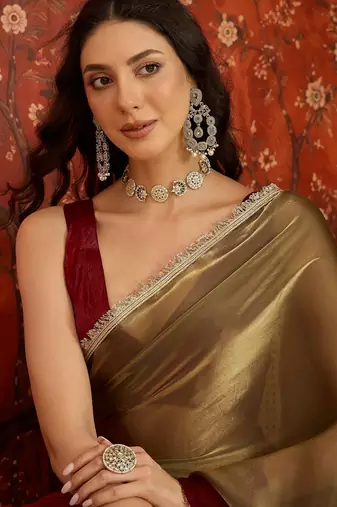 Wine & gold tissue satin sequins saree with unstitched blouse piece.