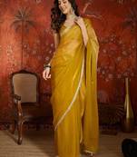 Yellow & gold tissue satin sequins saree with unstitched blouse piece.