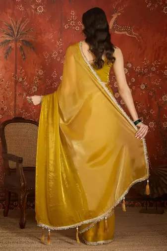 Yellow & gold tissue satin sequins saree with unstitched blouse piece.