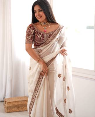Cream tissue satin embroidered saree with unstitched blouse piece. 2