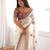 Cream tissue satin embroidered saree with unstitched blouse piece.