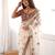 Cream tissue satin embroidered saree with unstitched blouse piece.