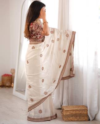 Cream tissue satin embroidered saree with unstitched blouse piece. 4