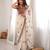 Cream tissue satin embroidered saree with unstitched blouse piece.