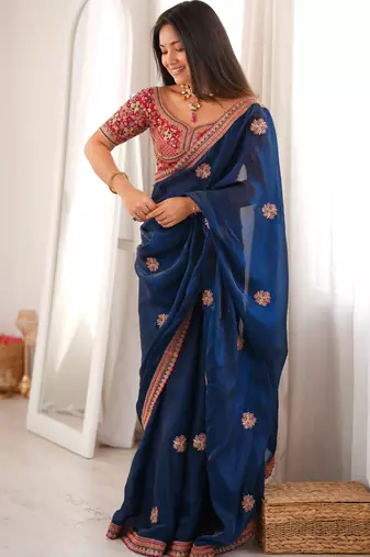Navy blue tissue satin embroidered saree with unstitched blouse piece.