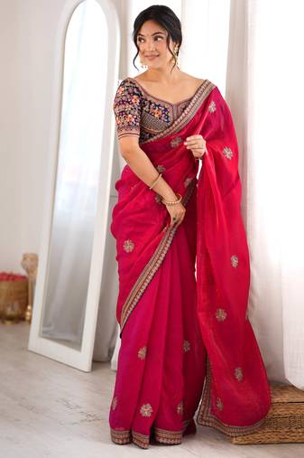 Rani tissue satin embroidered saree with unstitched blouse piece.