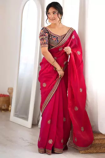 Rani tissue satin embroidered saree with unstitched blouse piece.