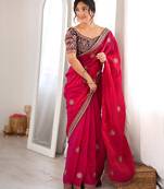 Rani tissue satin embroidered saree with unstitched blouse piece.