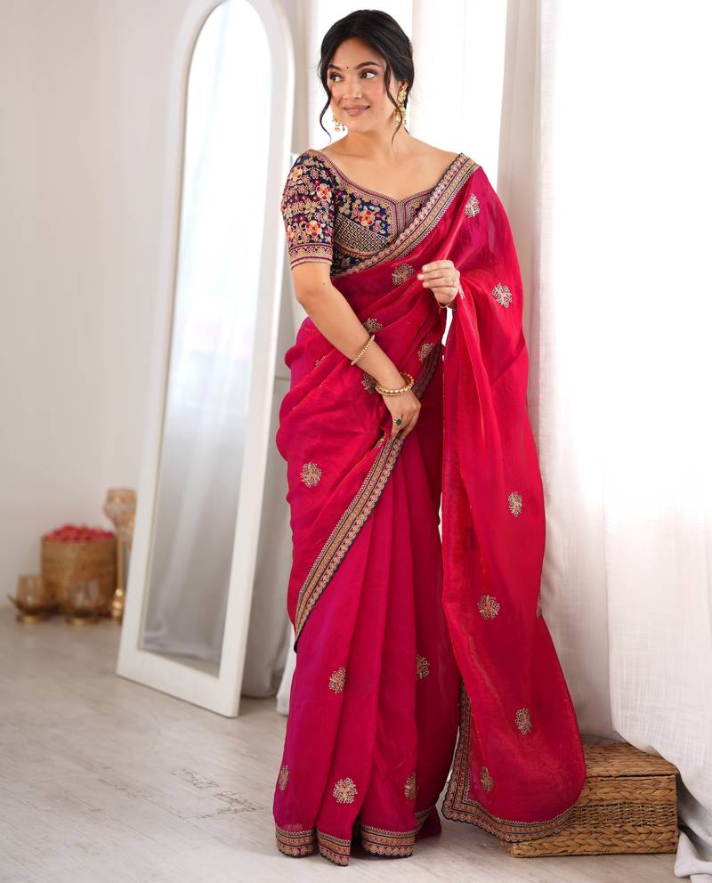 Rani tissue satin embroidered saree with unstitched blouse piece.