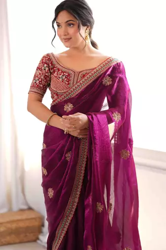 Wine tissue satin embroidered saree with unstitched blouse piece.