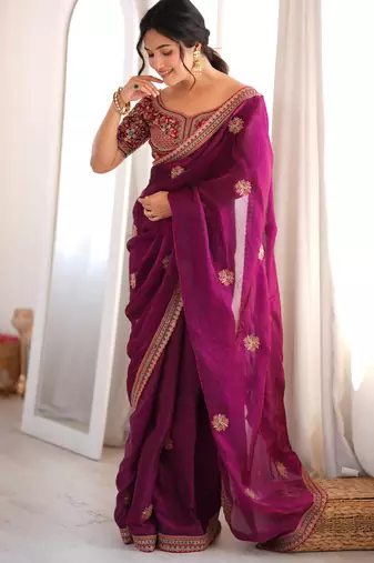 Wine tissue satin embroidered saree with unstitched blouse piece.