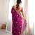 Wine tissue satin embroidered saree with unstitched blouse piece.