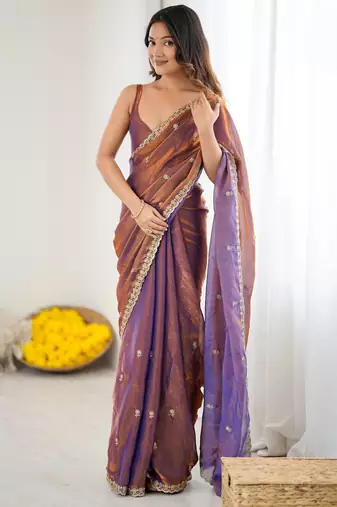 Brown tissue satin embroidered saree with unstitched blouse piece.