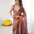 Brown tissue satin embroidered saree with unstitched blouse piece.
