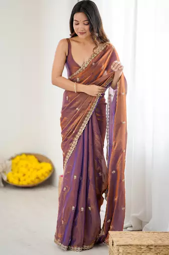 Brown tissue satin embroidered saree with unstitched blouse piece.