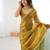 Gold tissue satin embroidered saree with unstitched blouse piece.