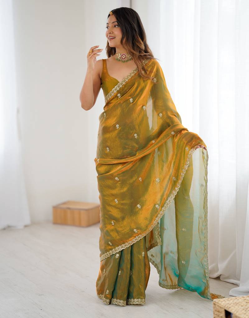 Gold tissue satin embroidered saree with unstitched blouse piece.